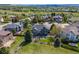 Aerial view of home with a stone patio, outdoor seating, modern fire pit and green space at 7067 Gray Fox Ct, Highlands Ranch, CO 80130