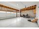 Spacious garage with clean epoxy flooring, ample lighting, and two car garage door at 7067 Gray Fox Ct, Highlands Ranch, CO 80130