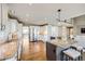Large kitchen with stainless steel appliances, granite countertops, and a center island with seating at 7067 Gray Fox Ct, Highlands Ranch, CO 80130
