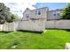 Well-maintained lawn and privacy fence offer a relaxing outdoor space at 9713 W Chatfield Ave # F, Littleton, CO 80128