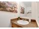 Well-lit half bath with granite countertop, decor and a mirror at 9713 W Chatfield Ave # F, Littleton, CO 80128
