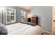 Comfortable bedroom with a dresser and a bright window view at 9713 W Chatfield Ave # F, Littleton, CO 80128