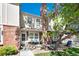 Charming townhome featuring brick accents, a cozy front porch, and a welcoming atmosphere at 9713 W Chatfield Ave # F, Littleton, CO 80128