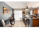 Bright kitchen area featuring a breakfast bar, table and chairs and lots of light at 9713 W Chatfield Ave # F, Littleton, CO 80128