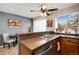 Open kitchen with a granite counter, stainless steel appliances and bright window view at 9713 W Chatfield Ave # F, Littleton, CO 80128