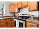 Modern kitchen equipped with stainless steel appliances and granite countertops at 9713 W Chatfield Ave # F, Littleton, CO 80128