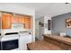 Convenient laundry area with modern washer and dryer adjacent to the kitchen at 9713 W Chatfield Ave # F, Littleton, CO 80128