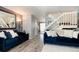 Open living area features hardwood floors, a staircase and neutral décor at 9713 W Chatfield Ave # F, Littleton, CO 80128