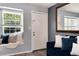 Cozy living room features a window seat, plush pillows, and warm natural light at 9713 W Chatfield Ave # F, Littleton, CO 80128