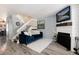 Cozy living room with hardwood floors, fireplace and staircase at 9713 W Chatfield Ave # F, Littleton, CO 80128