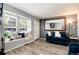 Comfortable living room showcasing a window nook, modern flooring, and stylish decor at 9713 W Chatfield Ave # F, Littleton, CO 80128