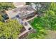 Sweeping aerial view of the neighborhood, highlighting the spacious lots and the verdant tree coverage at 13610 W Dakota Pl, Lakewood, CO 80228