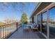 Inviting back deck featuring stylish outdoor furniture and a wrought iron railing, perfect for relaxation and enjoying the outdoor view at 13610 W Dakota Pl, Lakewood, CO 80228