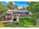 Lush backyard featuring a patio with grilling and dining space, perfect for entertaining, set amidst a well-maintained lawn at 13610 W Dakota Pl, Lakewood, CO 80228