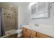 Bathroom with tiled shower, modern vanity, and updated fixtures at 13610 W Dakota Pl, Lakewood, CO 80228