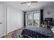 Bedroom with hardwood flooring, closet, a ceiling fan and neutral colored walls at 13610 W Dakota Pl, Lakewood, CO 80228