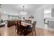 Elegant dining area seamlessly connecting to a bright living room and kitchen at 13610 W Dakota Pl, Lakewood, CO 80228