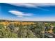 Scenic view of the surrounding landscape from the property, showcasing rolling hills and distant residential areas under a blue sky at 13610 W Dakota Pl, Lakewood, CO 80228