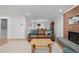 Relaxing living room featuring hardwood floors, stylish decor and a cozy fireplace at 13610 W Dakota Pl, Lakewood, CO 80228