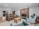 Spacious living room with cozy seating, a fireplace and seamless access to dining area at 13610 W Dakota Pl, Lakewood, CO 80228