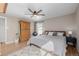 Well-lit bedroom showcasing hardwood floors, natural light, and neutral paint at 13610 W Dakota Pl, Lakewood, CO 80228