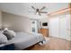 Comfortable bedroom featuring hardwood floors, closet, ceiling fan, and natural lighting at 13610 W Dakota Pl, Lakewood, CO 80228