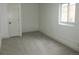 Basement with neutral carpet, fresh paint, white baseboards, and a window for natural light at 3243 Albion St, Denver, CO 80207