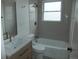 Newly renovated bathroom featuring subway tile, a modern vanity, and stylish fixtures at 3243 Albion St, Denver, CO 80207