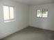 Bright bedroom with ample natural light and neutral carpeting at 3243 Albion St, Denver, CO 80207