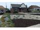 Charming brick home featuring a low maintenance yard and driveway leading to a covered parking area at 3243 Albion St, Denver, CO 80207