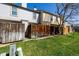 A view of the backyard with a grass and fences separating neighbors at 1621 S Idalia Cir # D, Aurora, CO 80017