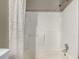 Bathroom featuring a bathtub-shower combo with tile walls at 1621 S Idalia Cir # D, Aurora, CO 80017