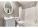 Bathroom featuring a white vanity, toilet and a shower-tub combo at 1621 S Idalia Cir # D, Aurora, CO 80017