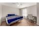 Bright bedroom with a ceiling fan, a window with blinds, and vinyl wood flooring at 1621 S Idalia Cir # D, Aurora, CO 80017