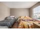 Bedroom with a bed and a nearby window at 1621 S Idalia Cir # D, Aurora, CO 80017