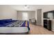 Bright bedroom with a ceiling fan, a window with blinds, and vinyl wood flooring at 1621 S Idalia Cir # D, Aurora, CO 80017