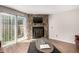 The living room's stone fireplace is a focal point, complemented by a sliding glass door to the outside at 1621 S Idalia Cir # D, Aurora, CO 80017