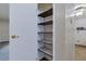 Storage closet featuring multiple shelves at 13606 E Bates Ave # 102, Aurora, CO 80014