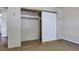 Open closet space featuring a shelf and sliding white doors at 13606 E Bates Ave # 102, Aurora, CO 80014