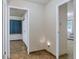 Hallway area with vinyl flooring and a view of two rooms at 13606 E Bates Ave # 102, Aurora, CO 80014
