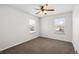 Bedroom featuring a ceiling fan and two windows at 1712 S Kline Way, Lakewood, CO 80232