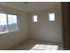 Empty bedroom with natural light from ample windows at 4551 N Quemoy St, Aurora, CO 80019