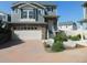 Charming two-story home with stone accents and a brick driveway, perfect for suburban living at 4551 N Quemoy St, Aurora, CO 80019