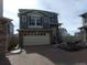 Charming two-story home with attached two-car garage and manicured landscaping at 4551 N Quemoy St, Aurora, CO 80019