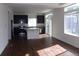 Modern kitchen with stainless steel appliances, granite countertops, and hardwood floors at 4551 N Quemoy St, Aurora, CO 80019