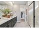 Elegant bathroom with double vanity, walk-in shower, and neutral color scheme at 17105 W 92Nd Loop, Arvada, CO 80007