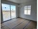 Dining room with sliding glass doors to the outdoor patio offering space and light at 17105 W 92Nd Loop, Arvada, CO 80007