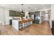 Beautiful kitchen with a spacious island, seating, and stylish decor that leads to the entryway at 17105 W 92Nd Loop, Arvada, CO 80007