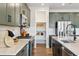 Stylish kitchen with stainless steel appliances, custom cabinets, and pantry at 17105 W 92Nd Loop, Arvada, CO 80007