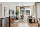 Bright living room with large windows, wood floors, stylish furnishings, and great views at 17105 W 92Nd Loop, Arvada, CO 80007